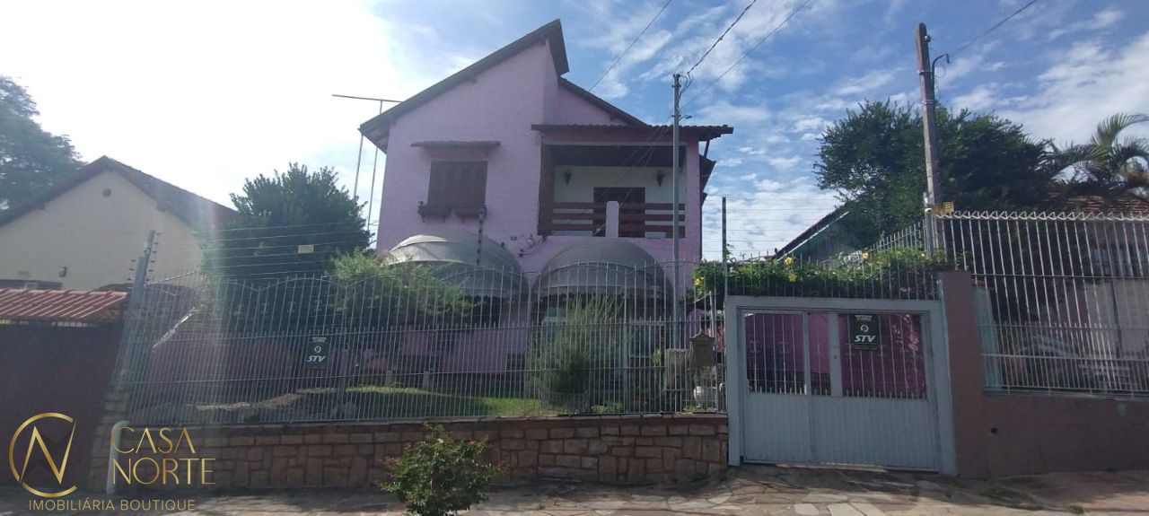 Casa à venda com 5 quartos, 206m², 1 suíte, 4 vagas, Rua Januário Scalzilli no bairro Santa Tereza em Porto Alegre