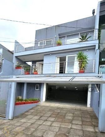 Casa de Condomínio à venda com 4 quartos, 284m², 1 suíte, 4 vagas, Rua Walter Porto Filho no bairro Mário Quintana em Porto Alegre