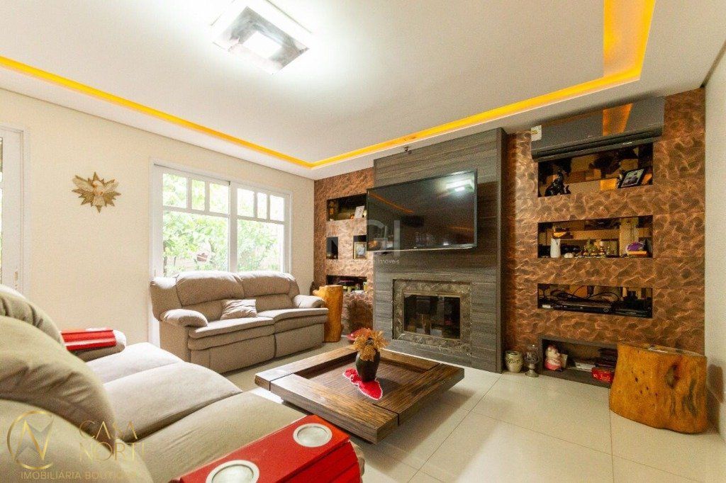 Casa de Condomínio à venda com 4 quartos, 446m², 4 suítes, 4 vagas, Rua Attílio Bilibio no bairro Jardim Carvalho em Porto Alegre