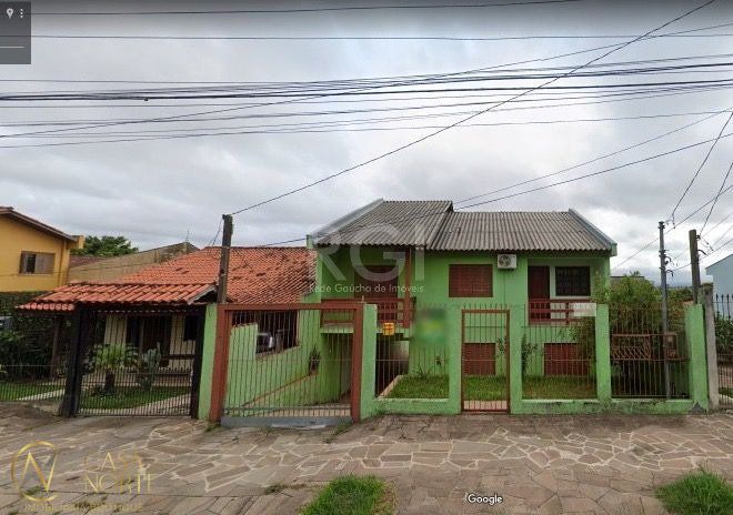 Casa à venda com 4 quartos, 204m², 1 suíte, 2 vagas, Rua Lauro Rodrigues no bairro Costa e Silva em Porto Alegre