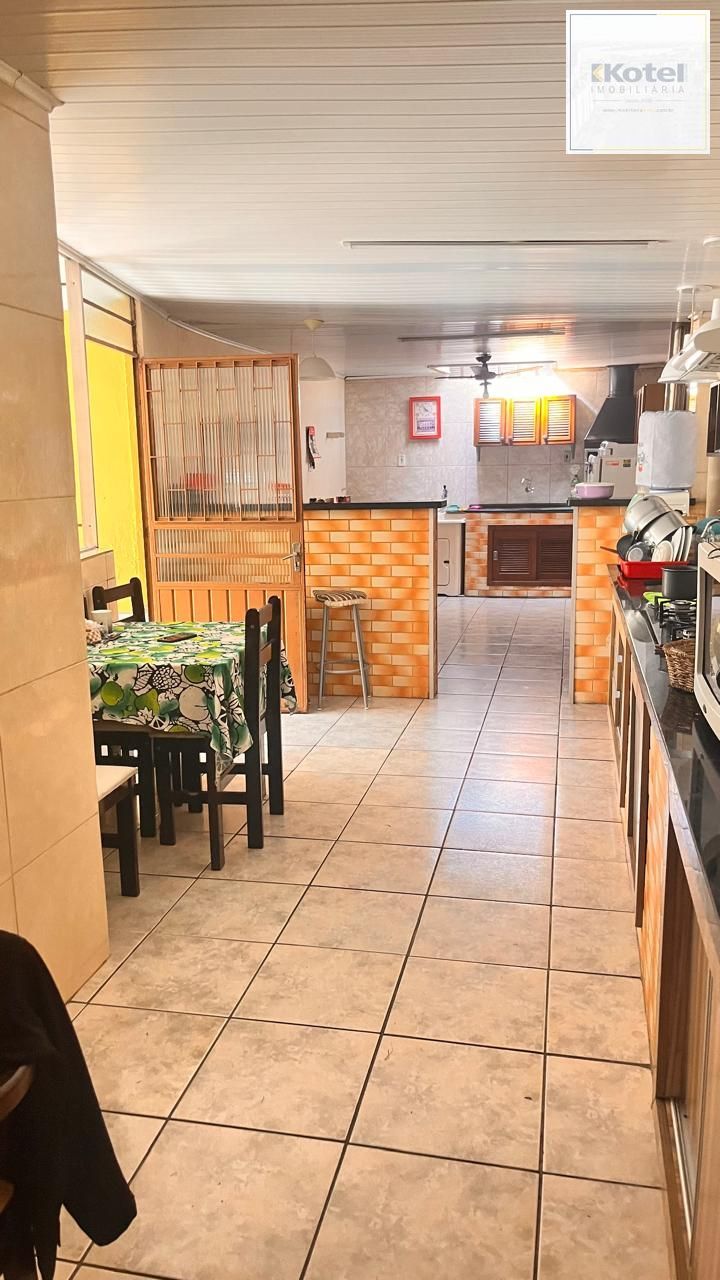 Casa térrea de 3 dormitórios, 3 vagas, churrasqueira pátio no bairro Ruben Berta — foto 3