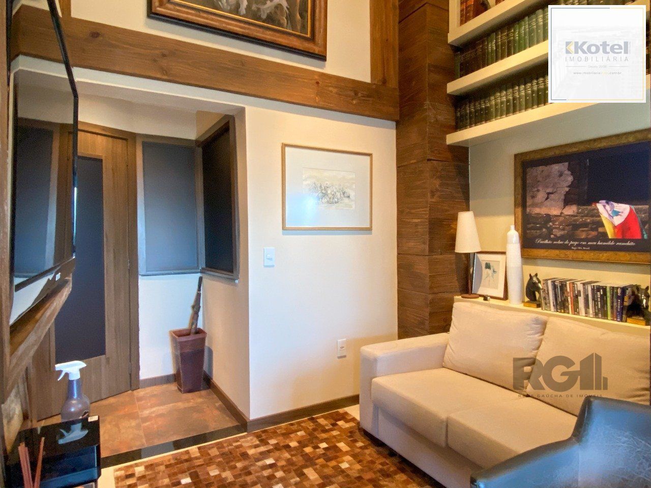Sala mobiliada, com churrasqueira para happy hour e vista para o Guaíba