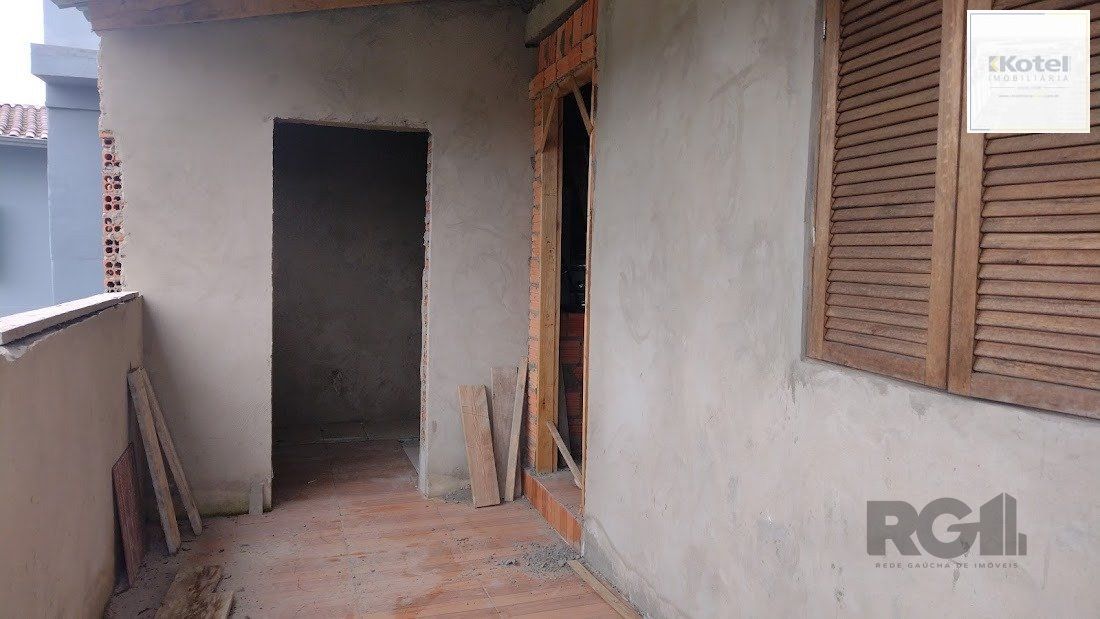 Casa de dois dormitórios localizada no Bairro Nonoai — foto 3
