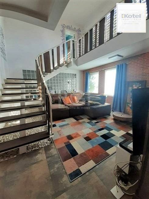 Casa com 233m², 2 dormitórios sendo 1 suíte, living com lareira, espaço gourmet com churrasqueira, pátio e 2 vagas de garagem no bairro Sarandi — foto 5