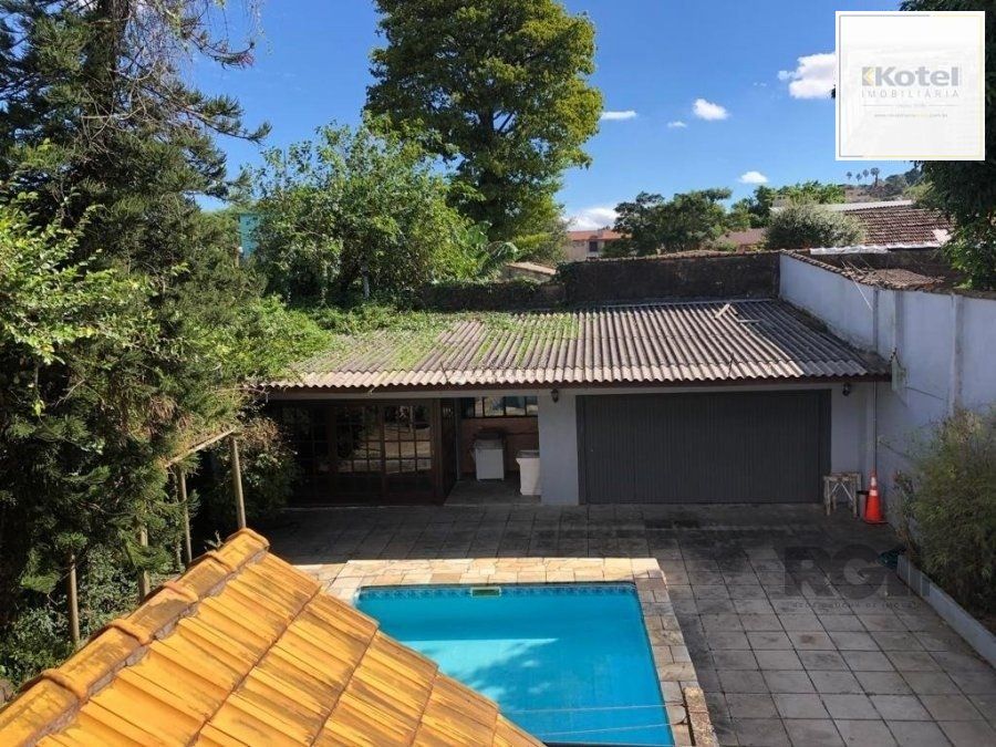 Casa de 365m² - 4 dormitórios sendo 3 suítes e 5 vagas de garagem no bairro Partenon — foto 4