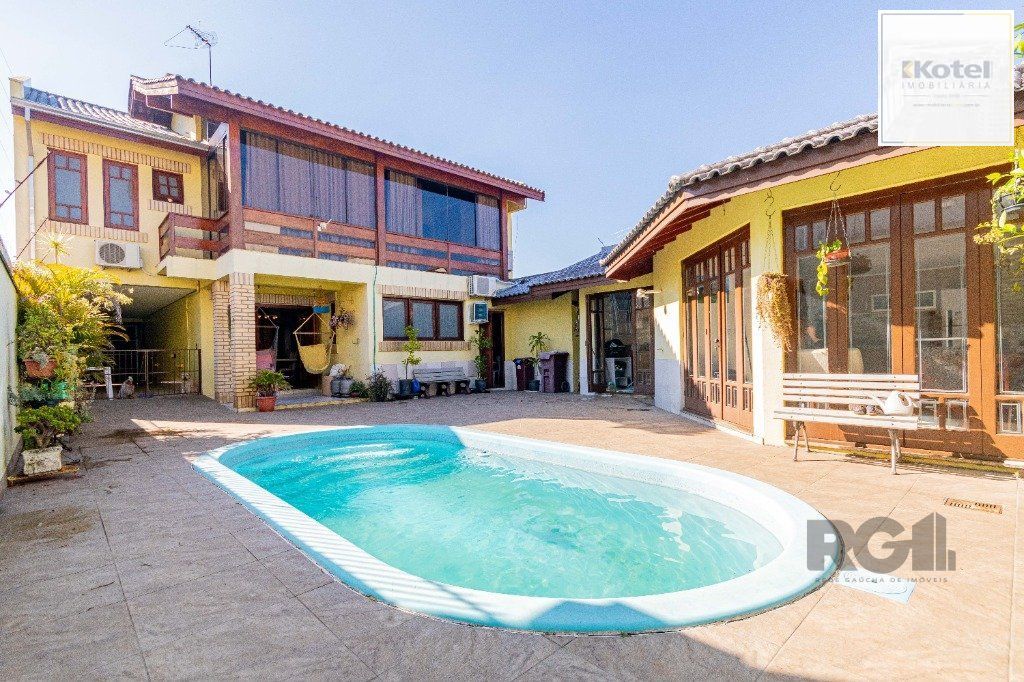 Casa de 4 dormitórios 304m² no bairro Jardim Lindóia — foto 2