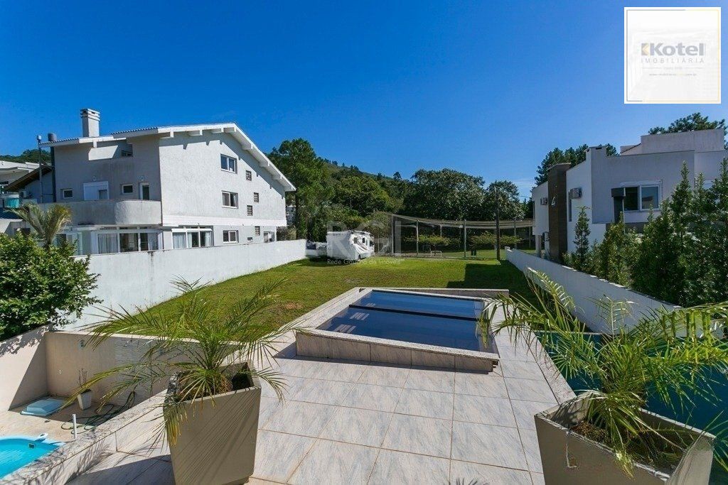 Excelente casa em condomínio com 3 suítes, piscina e 3 vagas de garagem — foto 5