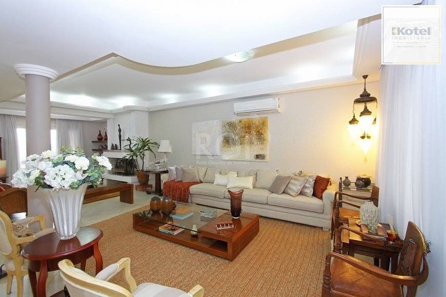 EXCELENTE CASA COM 4 DORMITÓRIOS, 6 VAGAS DE GARAGEM E VISTA PANORÂMICA. — foto 3