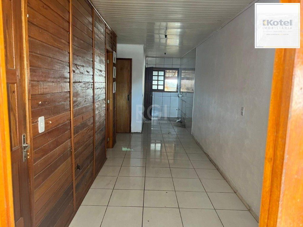 Terreno de 392m² com casa mista de 82m²