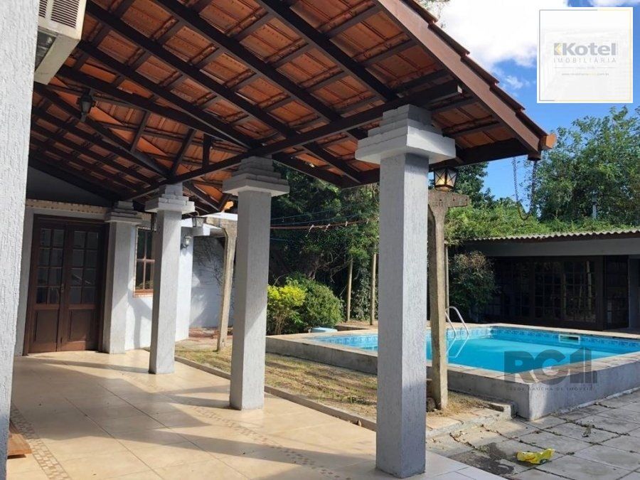 Casa de 365m² - 4 dormitórios sendo 3 suítes e 5 vagas de garagem no bairro Partenon — foto 2