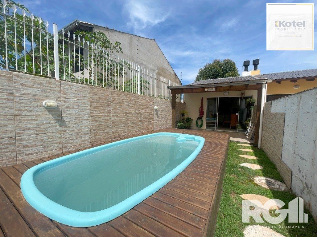 Bela casa três dormitórios localizada nos altos do bairro Guarujá — foto 5