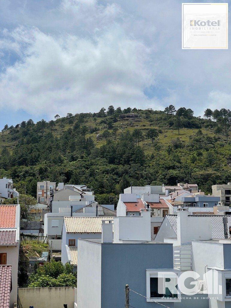 Bela casa três dormitórios localizada nos altos do bairro Guarujá — foto 2