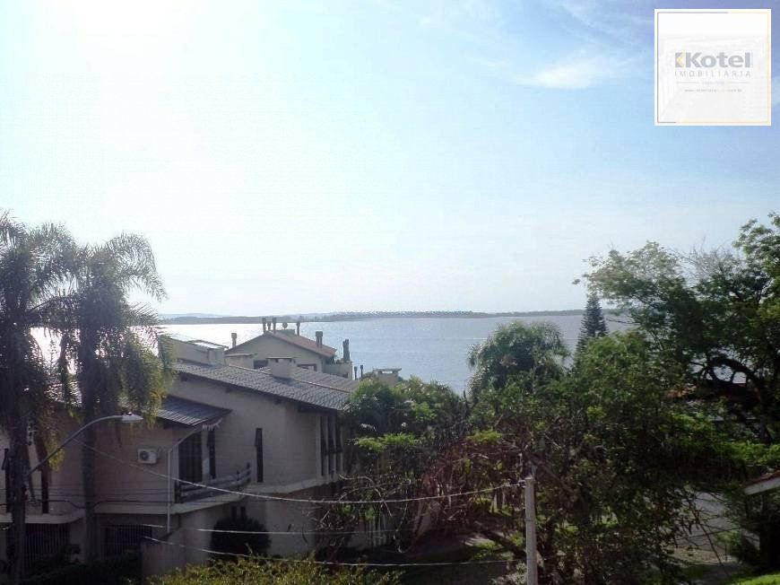 residência com vista panorâmica espetacular para o Guaíba em todos os cômodos da casa, hall de entrada, gabinete, lavabo, living para três ambientes com sacada e vista — foto 5