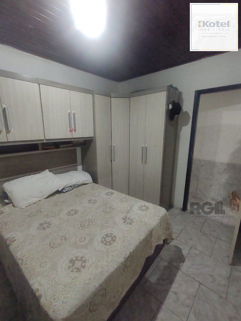 Casa de 3 dormitórios, 1 suíte e 2 vagas de garagem em Viamão.