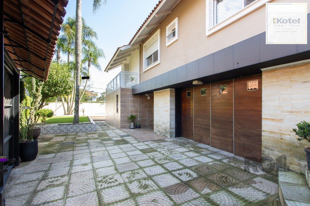 Casa a venda no bairro Guarujá com 4 dormitórios, piscina e salão de festas — foto 5