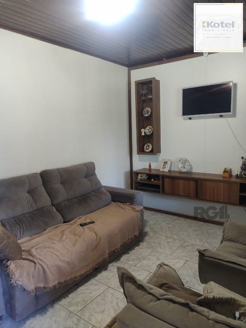 Casa de 3 dormitórios, 1 suíte e 2 vagas de garagem em Viamão.
