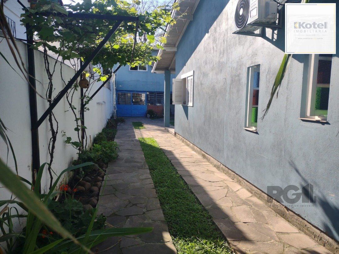 Casa com 250m²,  2 quartos, 1 suite, edícula, no bairro Nonoai — foto 4