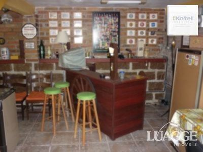 casa com 4 dormitórios, sendo uma suíte , e 530 area privativa