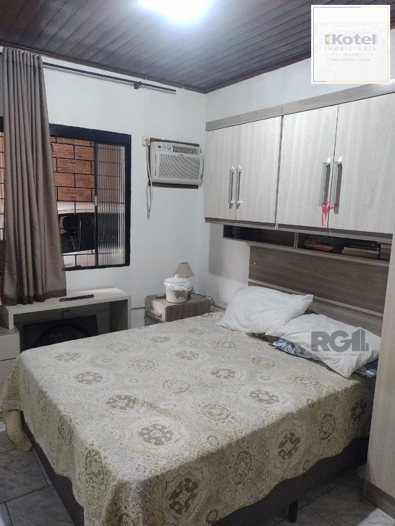 Casa de 3 dormitórios, 1 suíte e 2 vagas de garagem em Viamão.