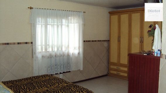 Casa térrea com 3 dormitórios - bairro  Ponta Grossa