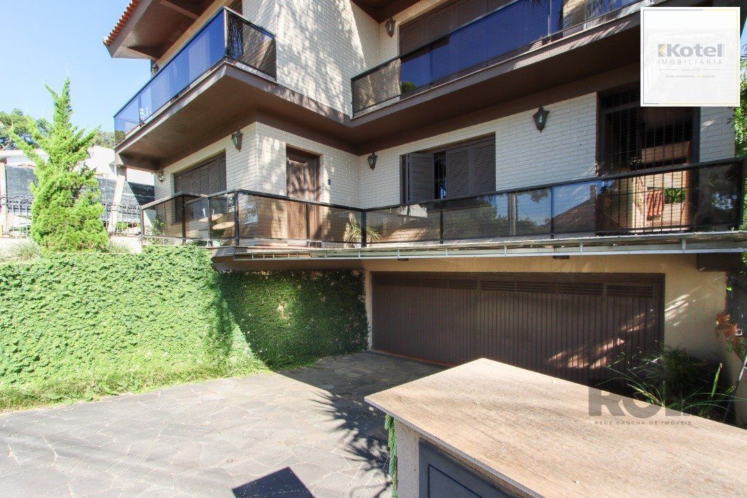 Casa a venda com 03 dormitórios, living 03 ambientes com vista para o Rio. — foto 2