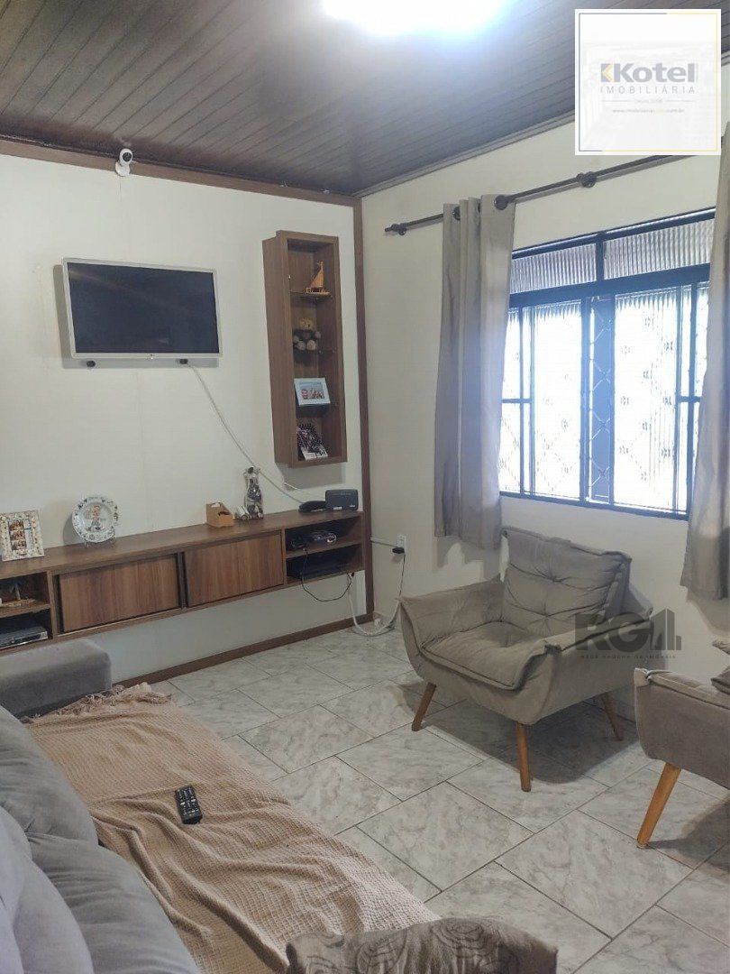Casa de 3 dormitórios, 1 suíte e 2 vagas de garagem em Viamão.