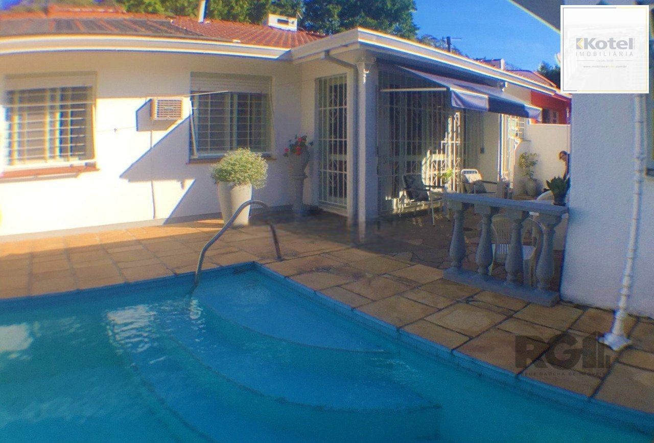 Casa com 3 dormitórios, localizada no bairro Jardim Itu em Porto Alegre/RS. — foto 2