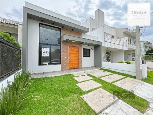 Casa em Porto Alegre, no bairro Hípica, com 3 dormitório(s), e 3 banheiros, à venda. — foto 2