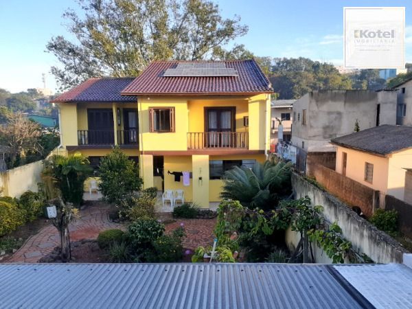 Casa em Porto Alegre, no bairro Nonoai, com 3 dormitório(s), e 3 banheiros, à venda. — foto 2