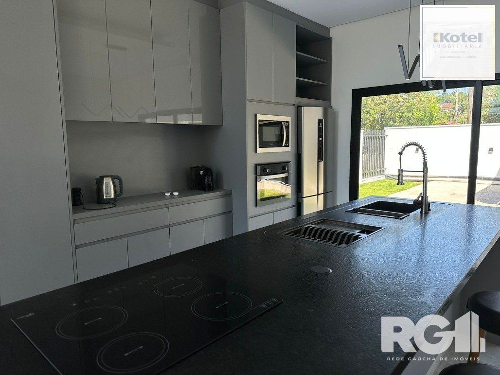 Casa de alto padrão a venda, totalmente mobiliada, com 2 dormitórios, 1 suite e 2 vagas no centro de Nova Santa Rita. — foto 4