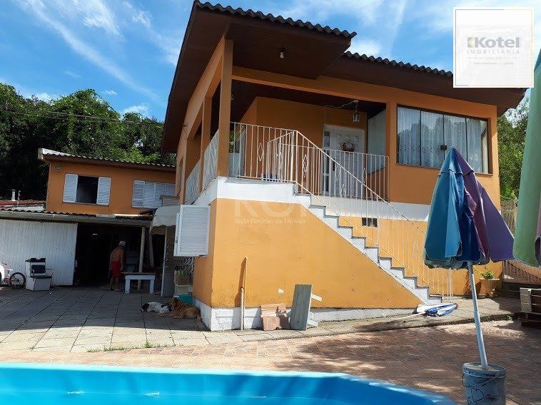 Casa com 4 dormitórios no bairro Vila Nova — foto 3