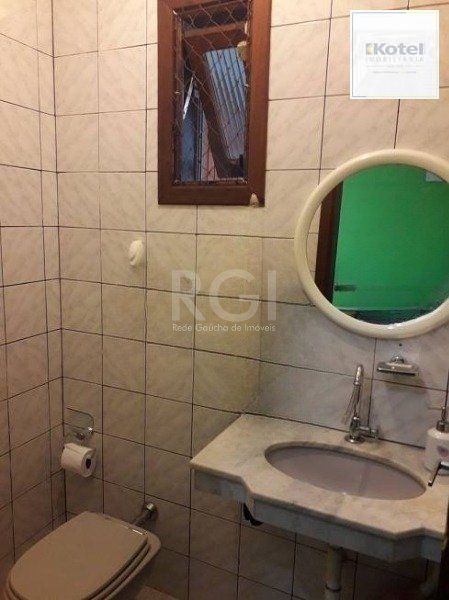 Casa no bairro Jardim Botânico de 3 dormitórios — foto 3