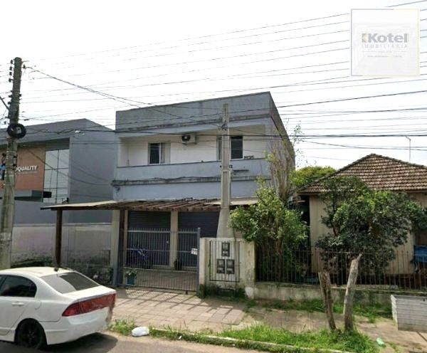 Prédio comercial e residencial no bairro Niterói com loja e apartamento
