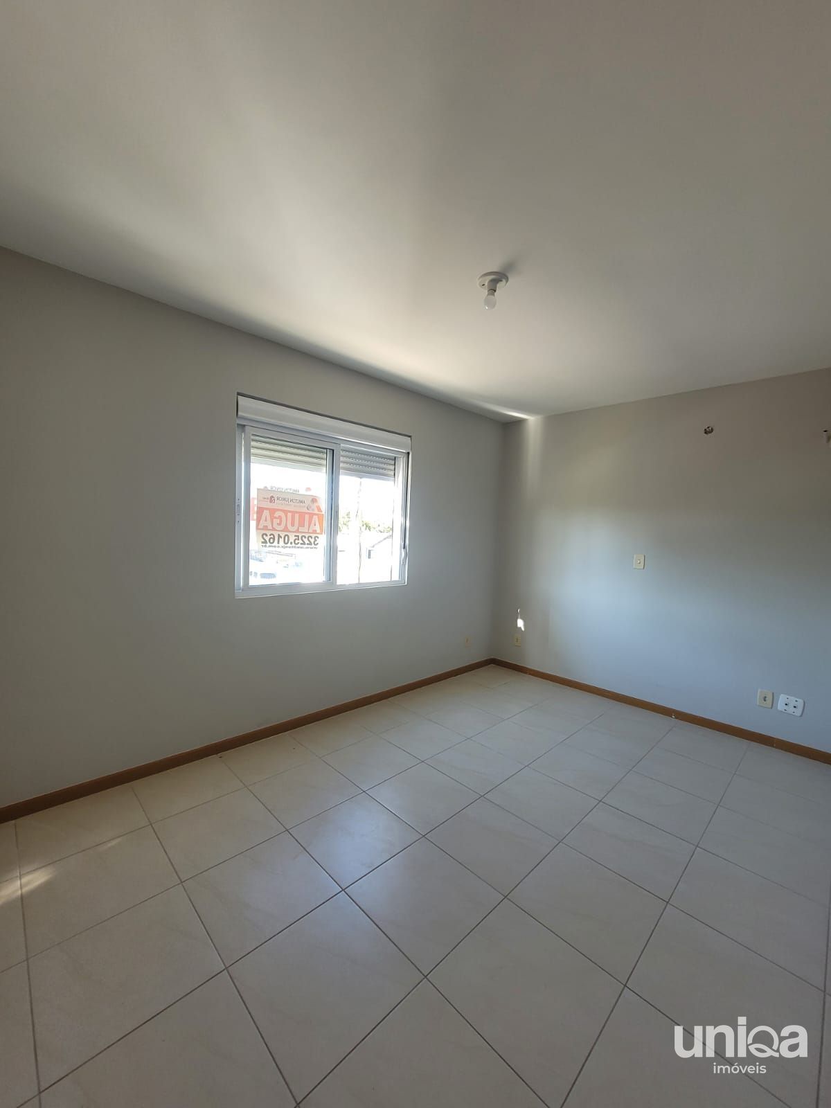 Apartamento com 3 dormitórios, sacada, churrasqueira e garagem próximo a UFSM
