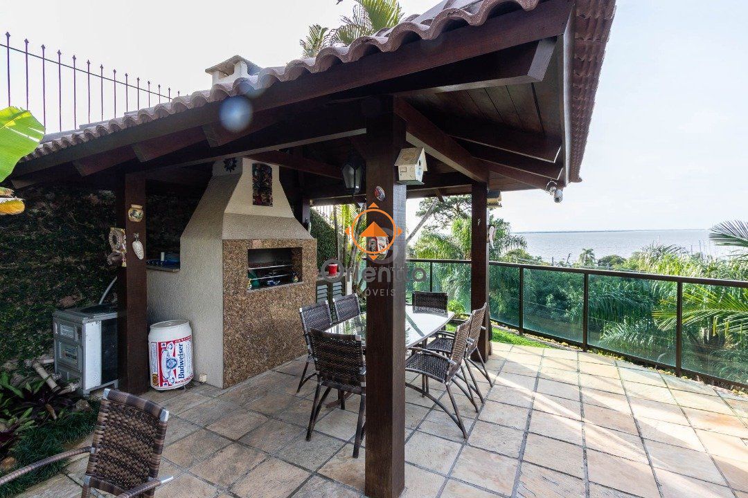 Casa com 430m², 4 dormitórios no bairro Vila Assunção em Porto Alegre para Comprar