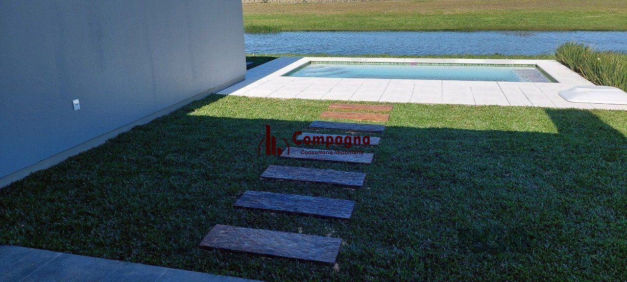 Casa em condomínio com 3 dormitórios, sendo todos suítes em Torres — foto 4