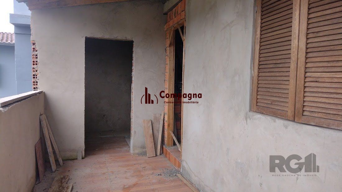 Casa de dois dormitórios localizada no Bairro Nonoai — foto 3