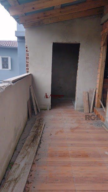 Casa de dois dormitórios localizada no Bairro Nonoai — foto 2