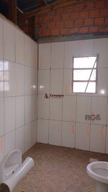Casa de dois dormitórios localizada no Bairro Nonoai — foto 5