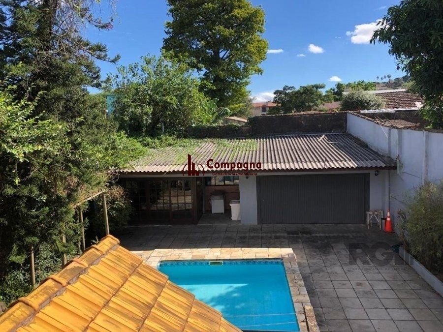 Casa de 365m² - 4 dormitórios sendo 3 suítes e 5 vagas de garagem no bairro Partenon — foto 4
