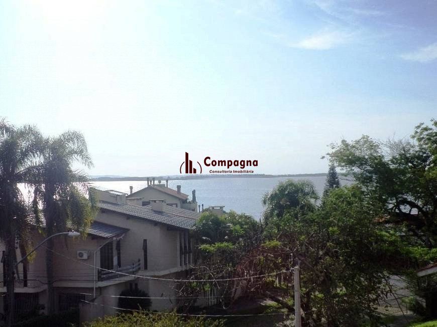 residência com vista panorâmica espetacular para o Guaíba em todos os cômodos da casa, hall de entrada, gabinete, lavabo, living para três ambientes com sacada e vista — foto 5