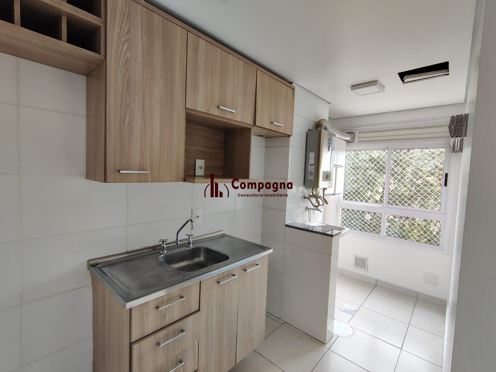Apartamento de 2 dormitórios, living, cozinha planejada, área de serviço, banheiro social e 1 vaga de garagem escriturada. — foto 4
