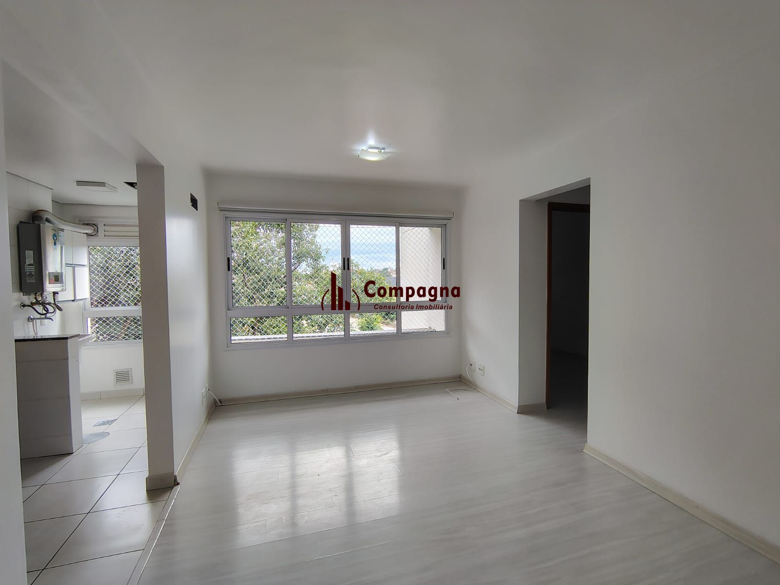 Apartamento de 2 dormitórios, living, cozinha planejada, área de serviço, banheiro social e 1 vaga de garagem escriturada. — foto 2