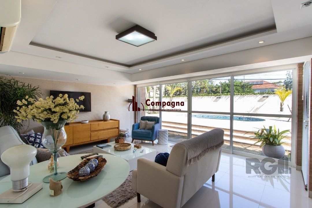 Casa a venda no bairro Guarujá com 4 dormitórios, piscina e salão de festas — foto 2