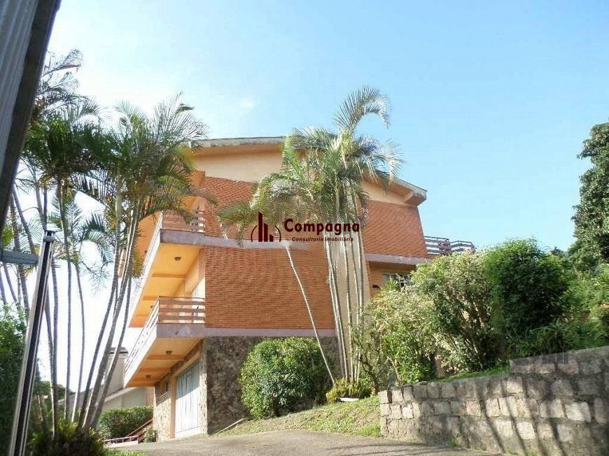 residência com vista panorâmica espetacular para o Guaíba em todos os cômodos da casa, hall de entrada, gabinete, lavabo, living para três ambientes com sacada e vista