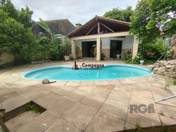 Casa em Porto Alegre, no bairro Ipanema, com 6 dormitório(s), e 6 banheiros, à venda. — foto 3