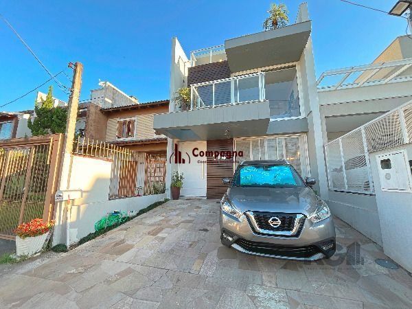 Casa em Porto Alegre, no bairro Hípica, com 3 dormitório(s), e 3 banheiros, à venda. — foto 2
