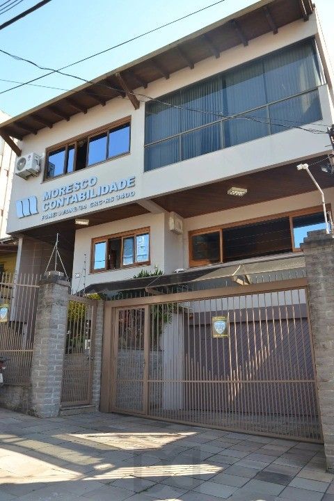 Casa Comercial e Residencial com 518m² (4 quartos / 5 banheiros / 3 vagas garagem) no Bairro Partenon localizada à meia quadra da Av. Bento Gonçalves. — foto 31