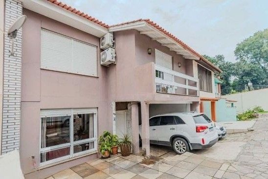 Casa em condomínio no bairro Santo Antônio de 4 dormitórios e 2 vagas — foto 1