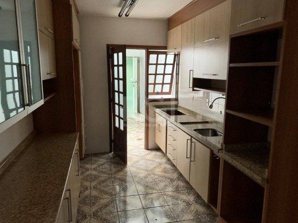 Casa no bairro Jardim Botânico de 3 dormitórios — foto 7
